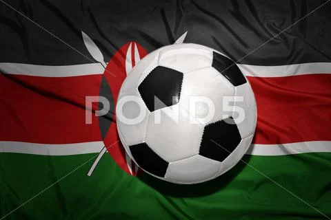 Black and white football ball on the national flag of kenya Stock Photos