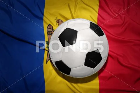 Black and white football ball on the national flag of moldova Stock Photos