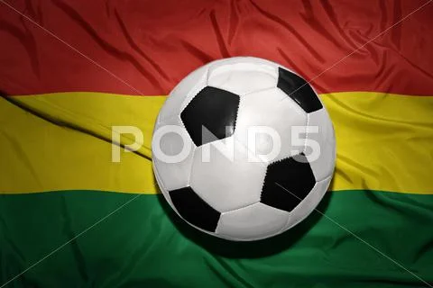 Black and white football ball on the national flag of bolivia Stock Photos