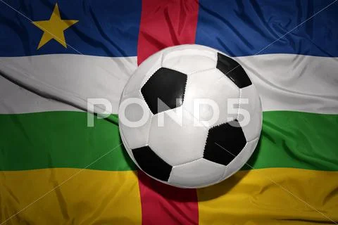Black and white football ball on the national flag of central african republi Stock Photos