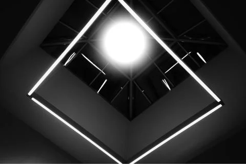 Black and white framework with glowing lamp background Foto stock