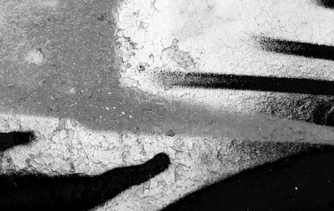 Black and white graffiti elements on a weathered wall with bold lines, abst.. 스톡 사진