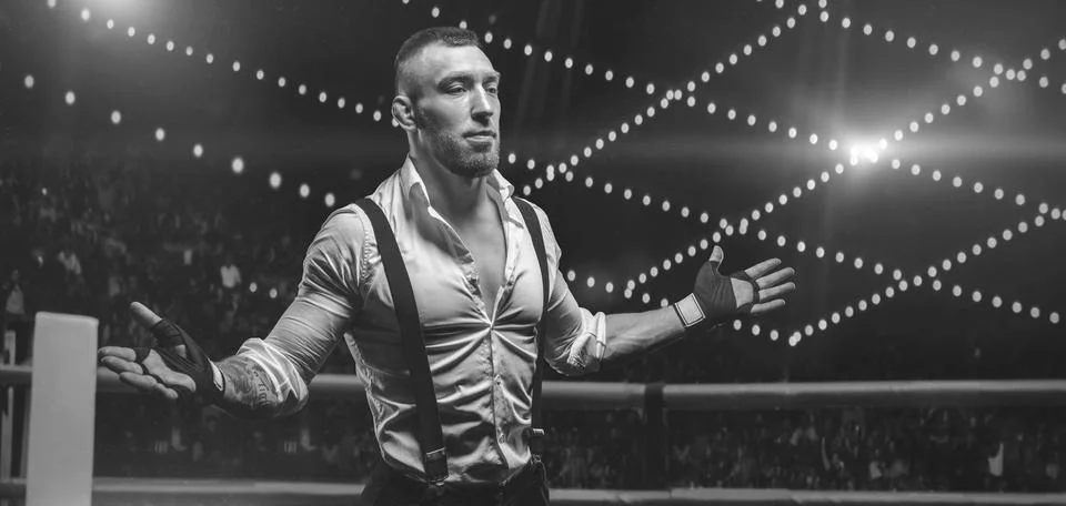 Black and white image of a bearded man in a white shirt and suspenders in t.. Stock Photos