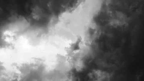 Black and white image of dramatic storm clouds swirling in the sky Stock Photos