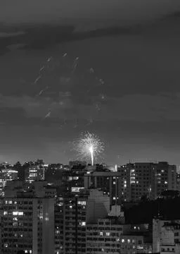 Black and white image with New Year's (Reveillon) fireworks exploding in the sky Stock Photos