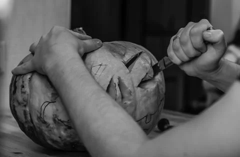 Black and white image preparing for the holiday. The process of carving a Hal Stock Photos