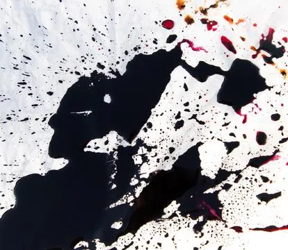 A black and white image of splattered ink on a white background Stock Photos