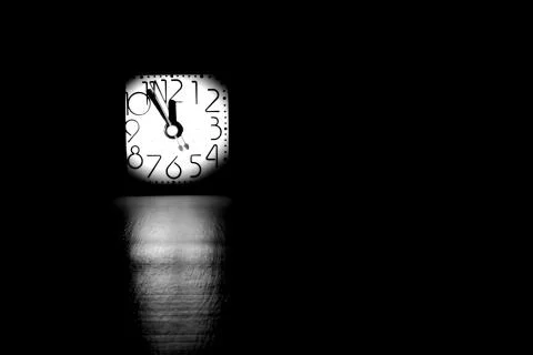 Black and white image of table clock Stock Photos