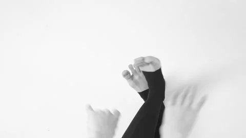 Black and white image. Young woman choreographer dancing in a black suit against Video stock 87268065