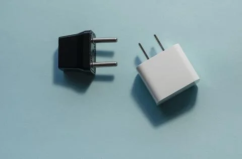 Black and white interchangeable DC and AC plugs. Stock Photos