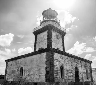 Black and white lighthouse with dramatic sky and clouds Stock Photos