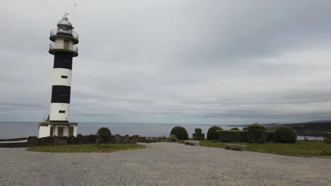 Black and white lighthouse of Ortiguera Asturias on the Atlantic coast Stock Footage 139971388