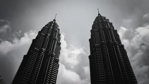 The black and white low angle view of the Petronas Twin Towers or KLCC. Stock Photos