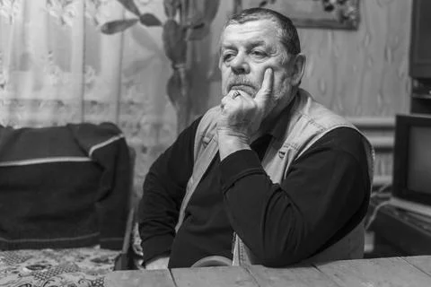 Black and white low key portrait of bearded Ukrainian senior peasant Stock Photos