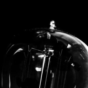 Black and white macro view of edison lightbulb Stock Photos