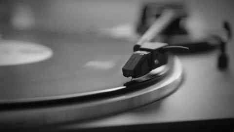 Black and White. The needle rises from a vintage vinyl record. The vinyl record Stock Footage 146790643