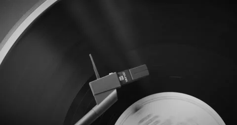 Black and White. The needle rises from a vintage vinyl record. The vinyl record Stock Footage 147155111