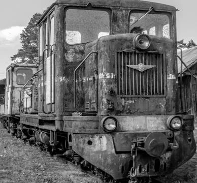 Black and white old train on railroad track. Retro steam train in museum. Stock Photos