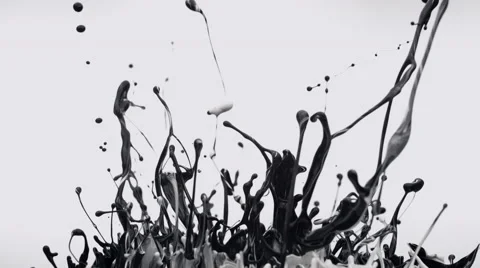 Black and white paint bouncing and making splash. Slow Motion. Stock Footage 51804656