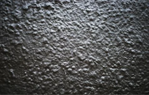 Black and white painted bumpy concrete street wall background Stock Photos