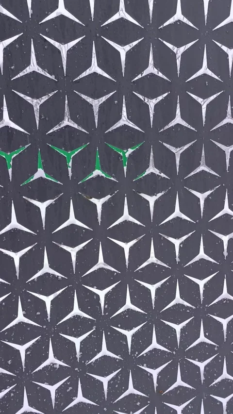 A black and white pattern with green accents on a wall Stock Footage 295200376