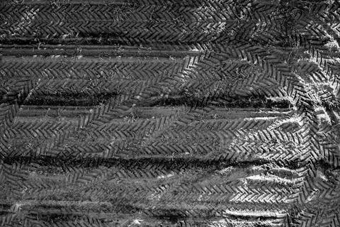 Black and white pattern of overlapping tractor tire tracks on agricultural .. Stock Photos