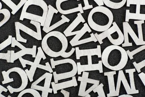 Black and white pattern of randomly placed letters of English alphabet. Close Foto stock