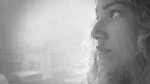 Black and white portrait of a young depressed woman on the bus Stock Footage