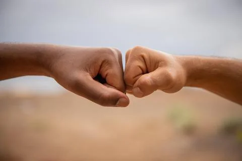 Black and white punches together. Diversity concept. Foto stock