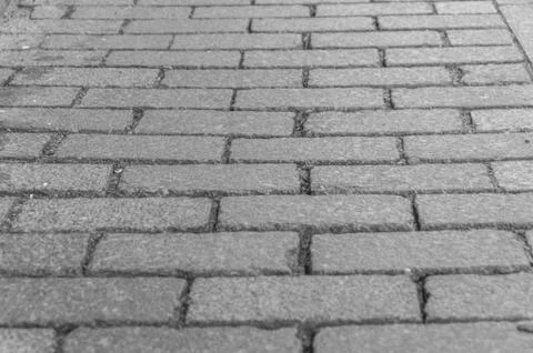 Black and white, the road with rectangular, uniform sidewalk for the backgrou 写真素材