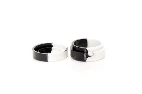 Black and white round plastic containers on white background Stock Photos