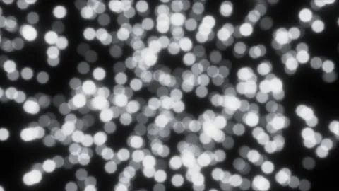 Black and white shining light particles defocused looping background Video stock 149743036