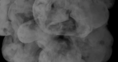 Black and white smoke explosion slowly floating through space against black Stock Footage 289612967