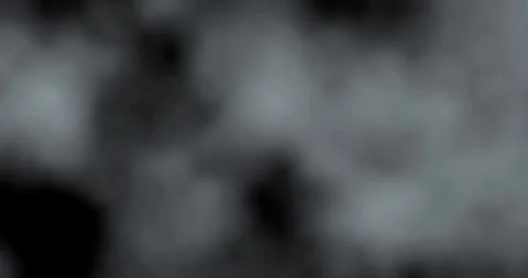 Black and white smoke explosion slowly floating through space against black Stock Footage 330481273