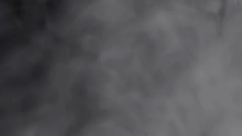 Black and white smoke explosion slowly floating through space against black 스톡 동영상 332661865