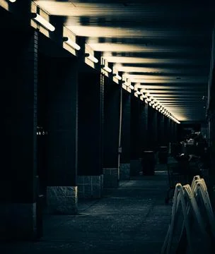 Black and white split tone of the sidewalk outside of a shopping plaza in Cha Stock Photos