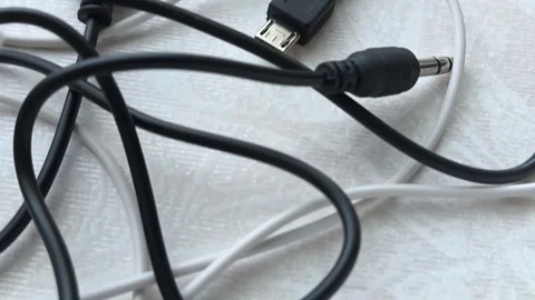 Black and white tangled cables, wires on the table at home close-up. The concept Video stock 316117751