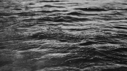 Black and white texture of ripples in the sea Video stock 334323204