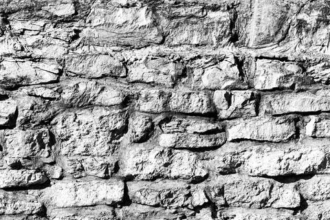 Black and white texture of a wall made of stones. Abstract background. Foto stock