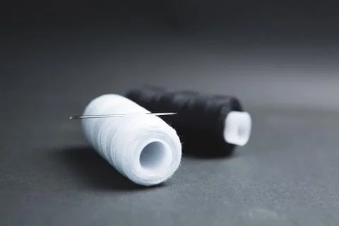 Black and white thread on the table Stock Photos