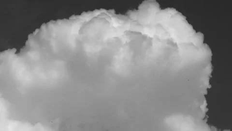 Black and white time lapse of a single dramatic cumulus cloud Video stock 346212124