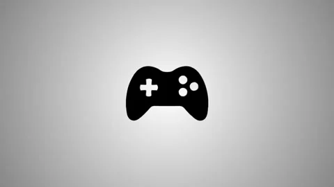 Black and white video game controller icon appears and shines on a gradient.. Stock Footage 346491141