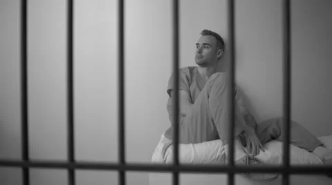Black and white view of Sad inmate reflecting on life in prison Stock Footage 60574361