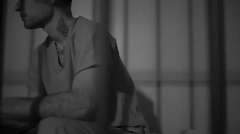 Black and white view of scene of a tattooed gang member in prison Stock-Footage 60574430