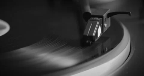 Black and White. The vinyl record is spinning. The needle plays on a vintage Stock Footage 147155162