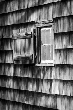 Black and white window on rustic cabin Stock Photos