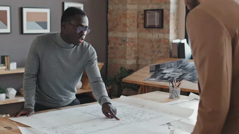 Black Architect Talking to Colleague Stock Footage 203883124