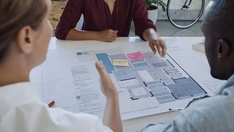 Black architect working with female designer Video stock 73223363