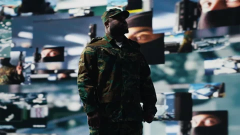 Black army officer working in a virtual war zone with digital satellite data Stock Footage 312304859