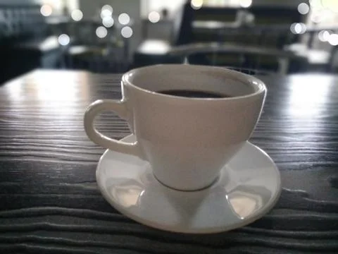 Black aromatic coffee on the table Stock Photos
